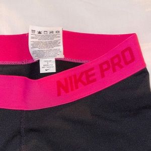 Black and pink Nike pro shorts